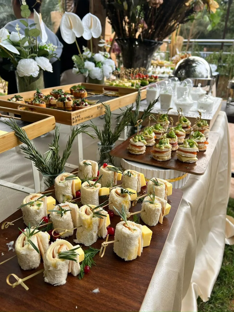 An abundant catering display prepared outdoors at Nibras