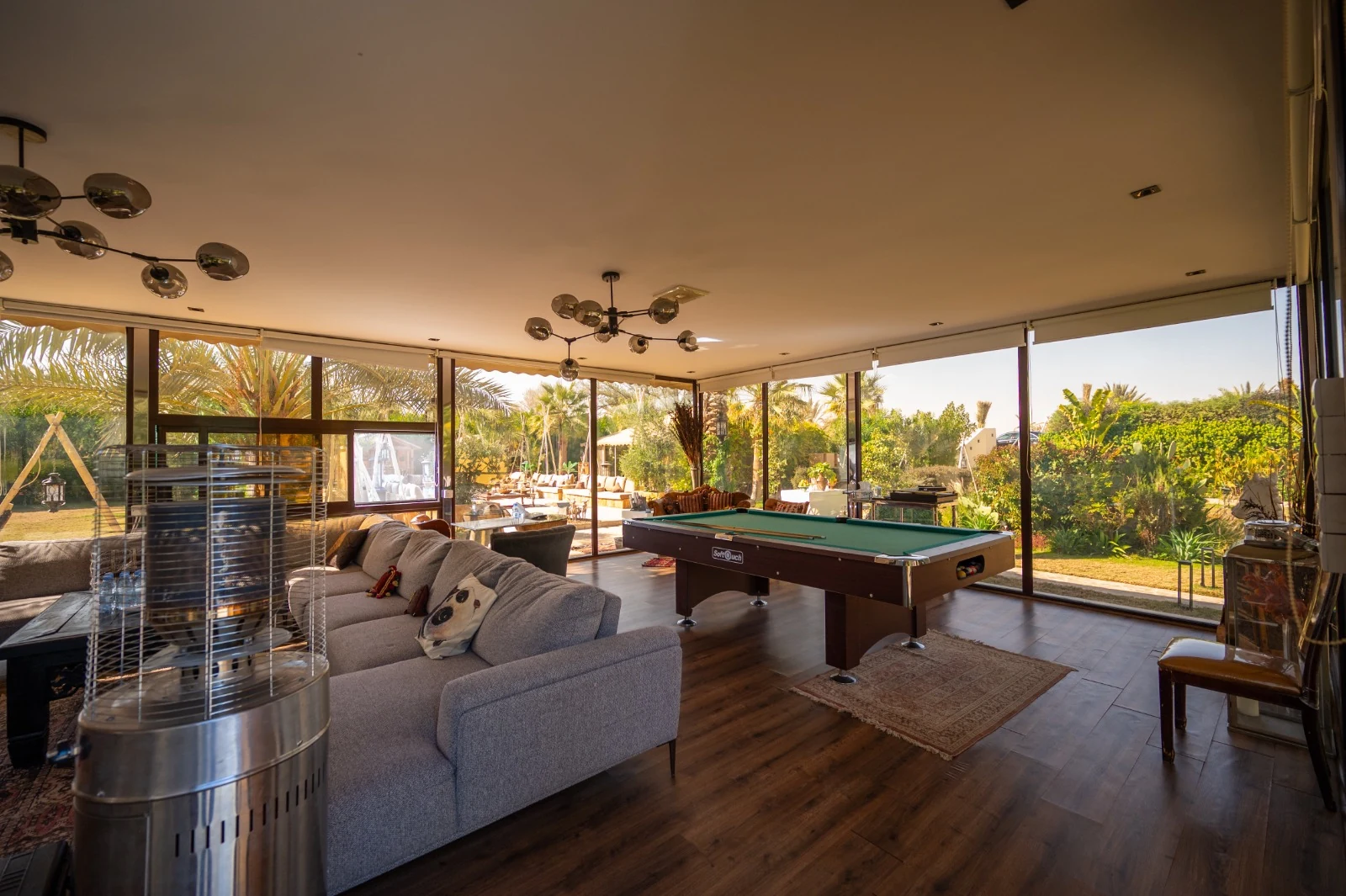 The glass pavilion lounge overlooking the gardens